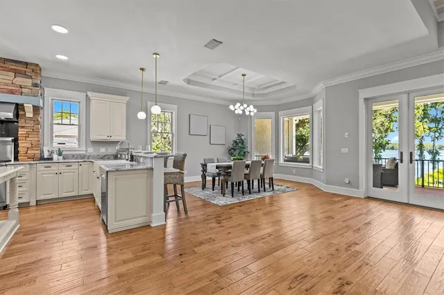 a view of a swimming pool with lounge chairs in patio