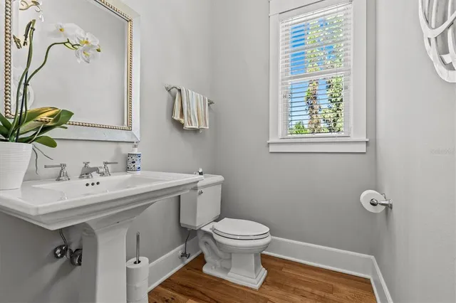 a bathroom with a sink a vanity and a mirror