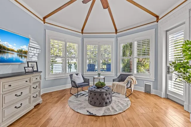 a spacious bedroom with a bed and a dresser