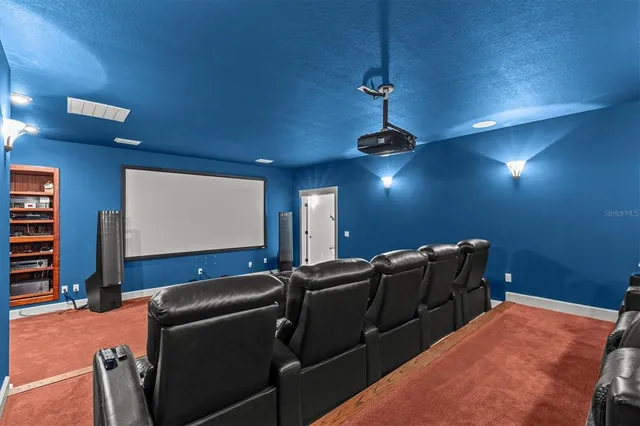 a front view of a house with swimming pool having outdoor seating