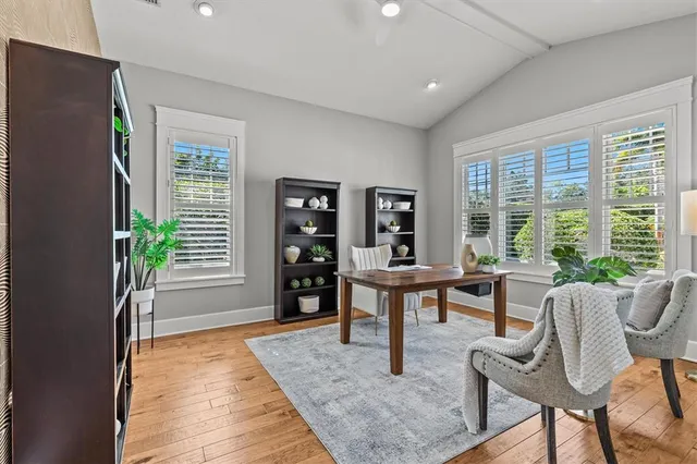 a view of a dining room with furniture window and wooden floor
