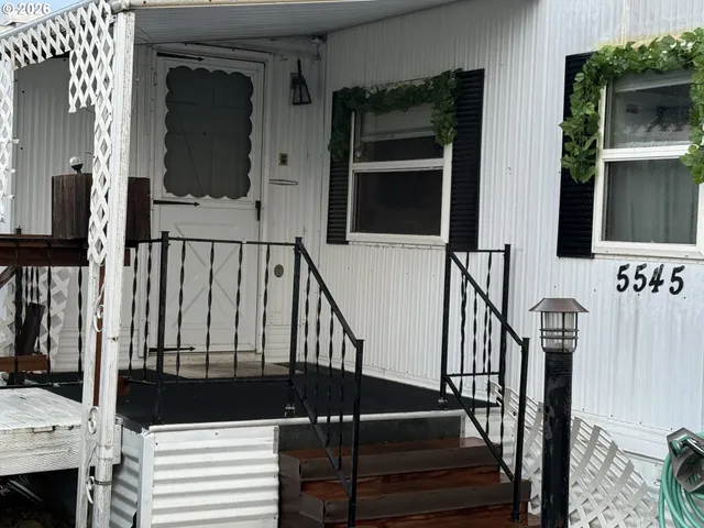 a view of balcony stairs with wooden floor