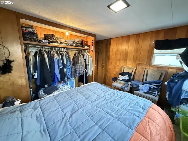 a bed room with a bed and a walk in closet