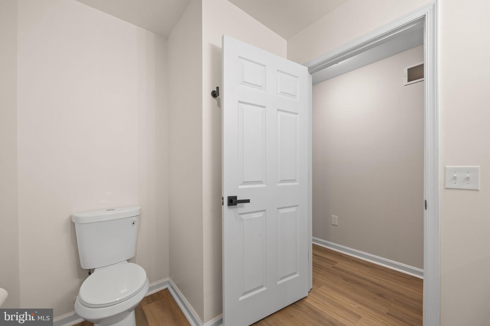 24 Bizarre Drive New Castle, DE 19720 - Photo 12 of 26 a white toilet sitting next to a shower