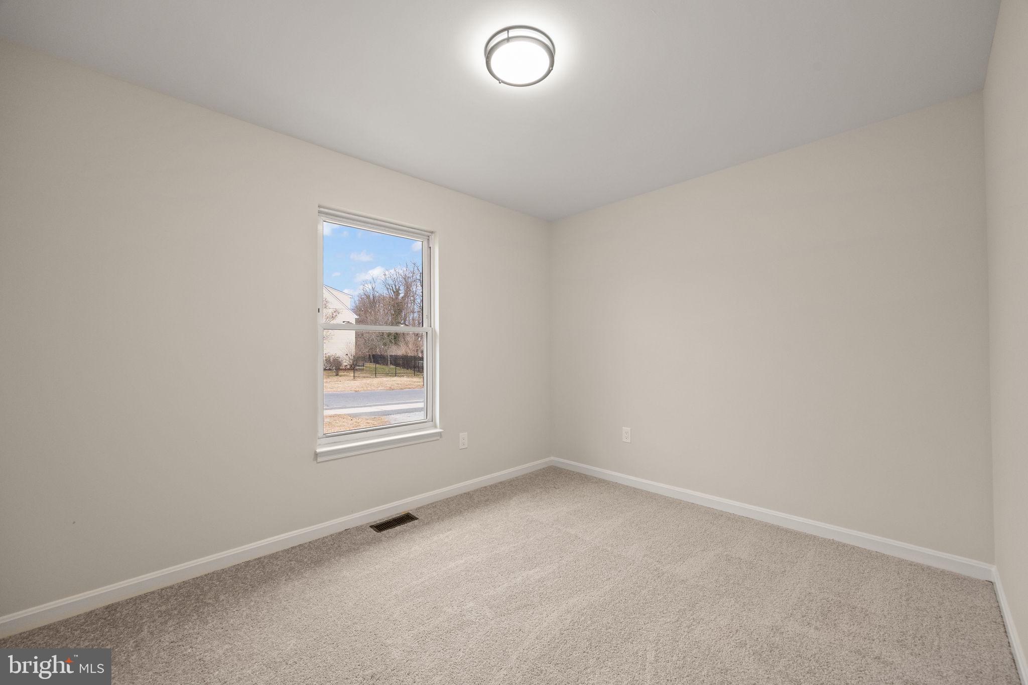 24 Bizarre Drive New Castle, DE 19720 - Photo 13 of 26 an empty room with a window