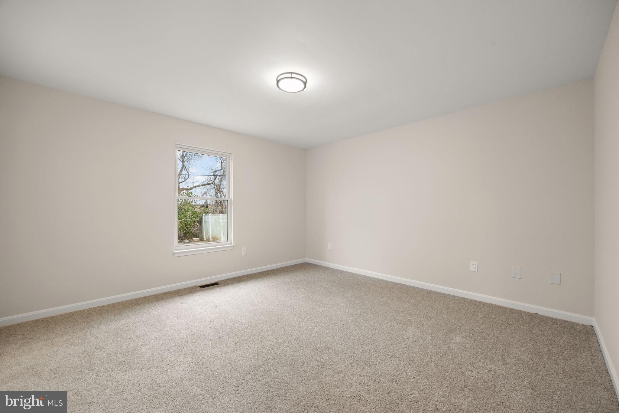 24 Bizarre Drive New Castle, DE 19720 - Photo 17 of 26 an empty room with windows