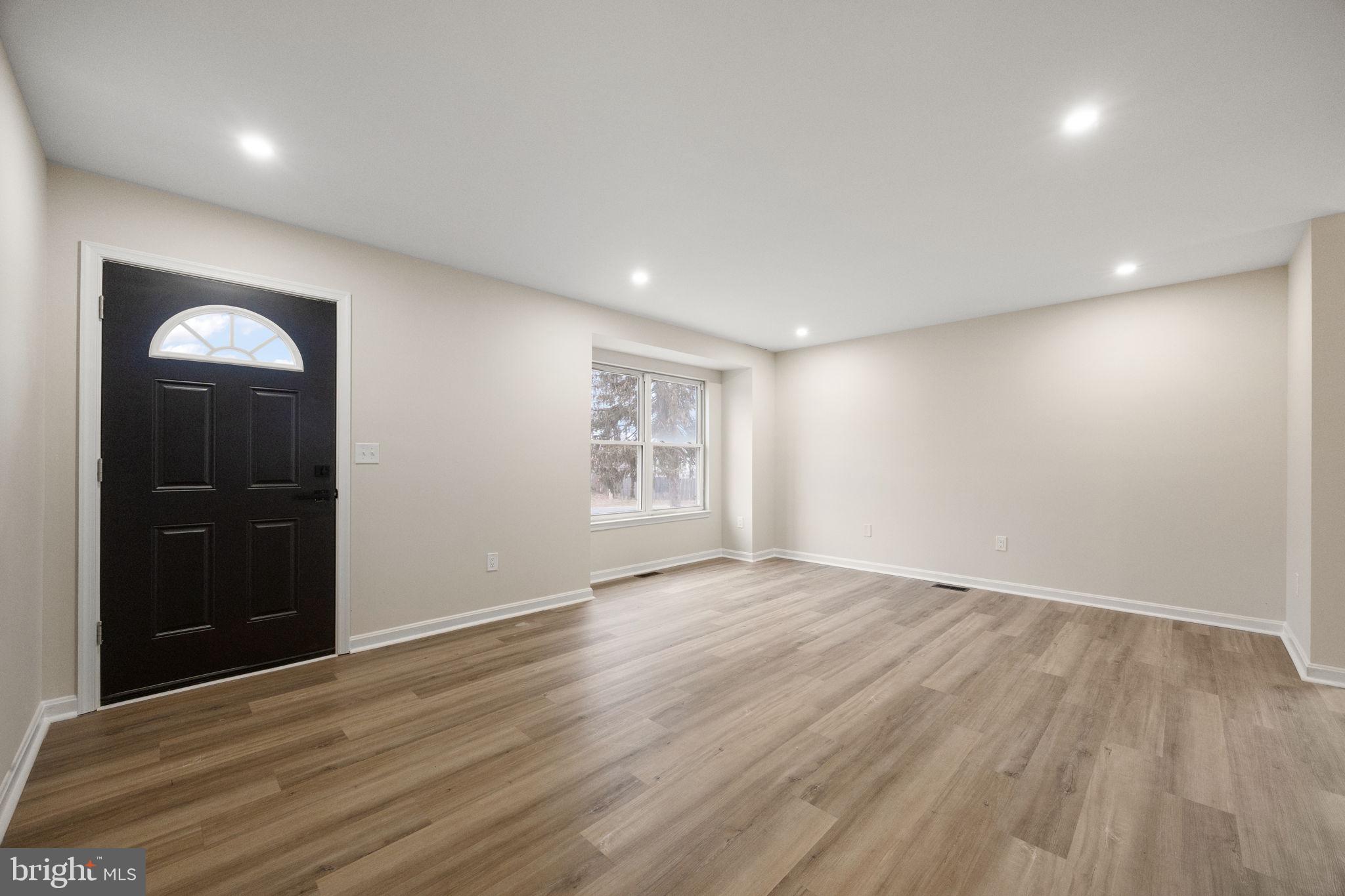 24 Bizarre Drive New Castle, DE 19720 - Photo 5 of 26 a view of an empty room with wooden floor and closet