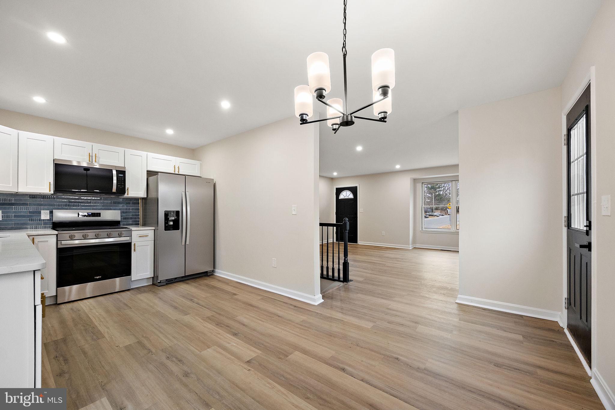 24 Bizarre Drive New Castle, DE 19720 - Photo 7 of 26 a view of a kitchen with stainless steel appliances refrigerator stove microwave and cabinets
