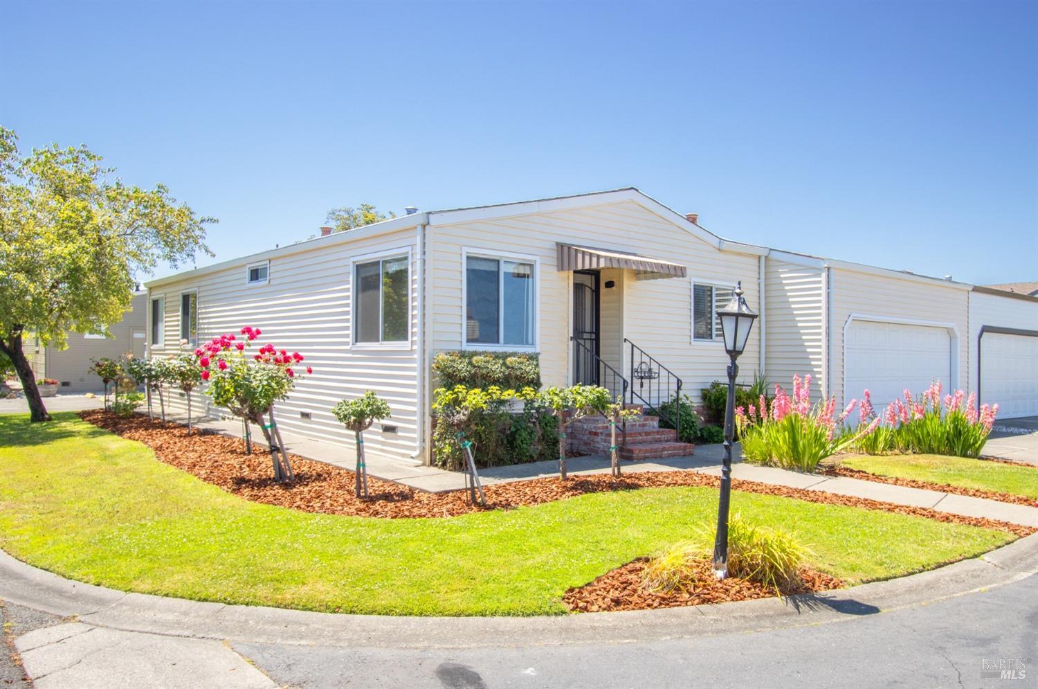 a house view with swimming pool in front of it