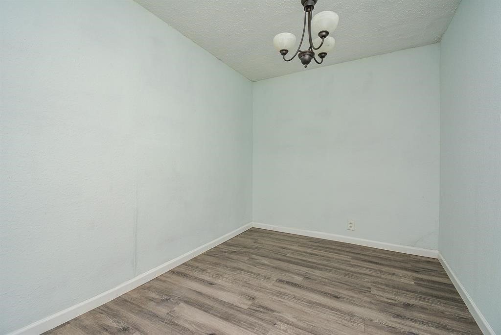917 Defender Street Houston, TX 77029 - Photo 14 of 14 a view of a room with wooden floor and roof