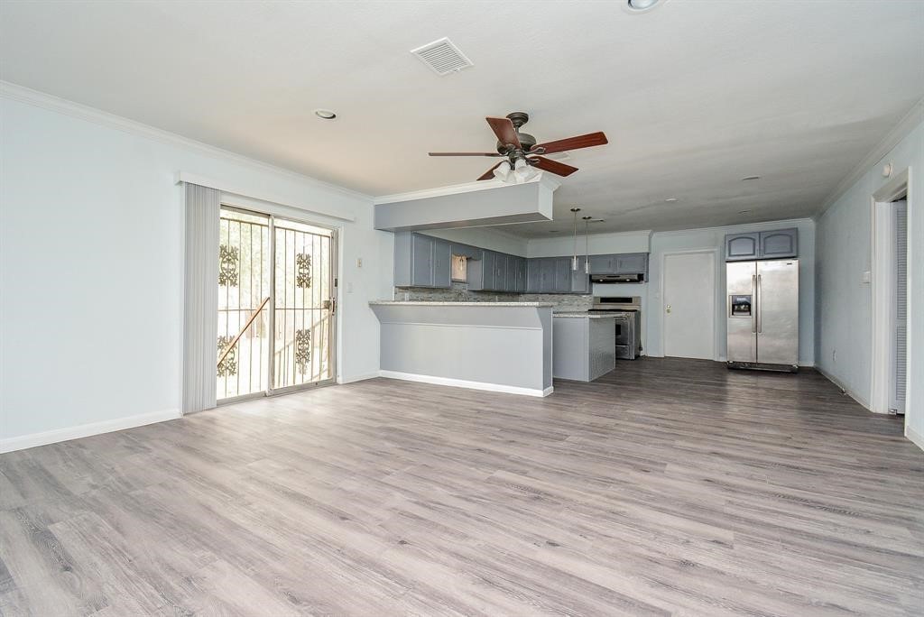 917 Defender Street Houston, TX 77029 - Photo 5 of 14 a view of a kitchen with a sink stove cabinets and empty room