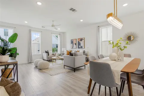a living room with fireplace furniture and a wooden floor