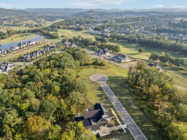 an aerial view of residential house with outdoor space
