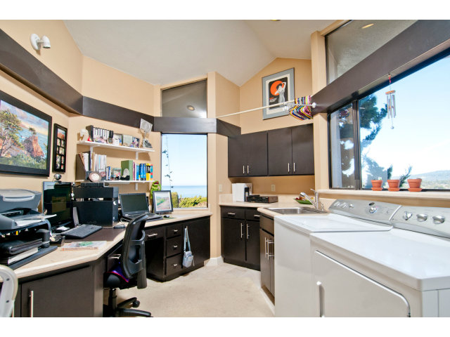 2697 Pradera Road Carmel, CA 93923 - Photo 12 of 22 a kitchen with a sink a stove and cabinets