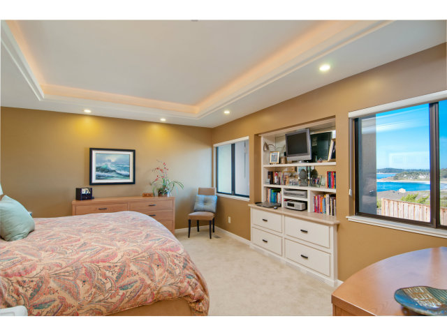 2697 Pradera Road Carmel, CA 93923 - Photo 13 of 22 a bedroom with furniture and flat screen tv