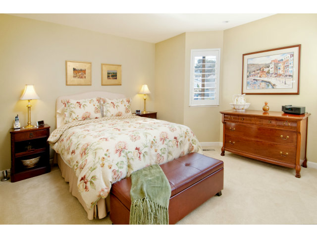 2697 Pradera Road Carmel, CA 93923 - Photo 19 of 22 a bedroom with a bed and a dresser
