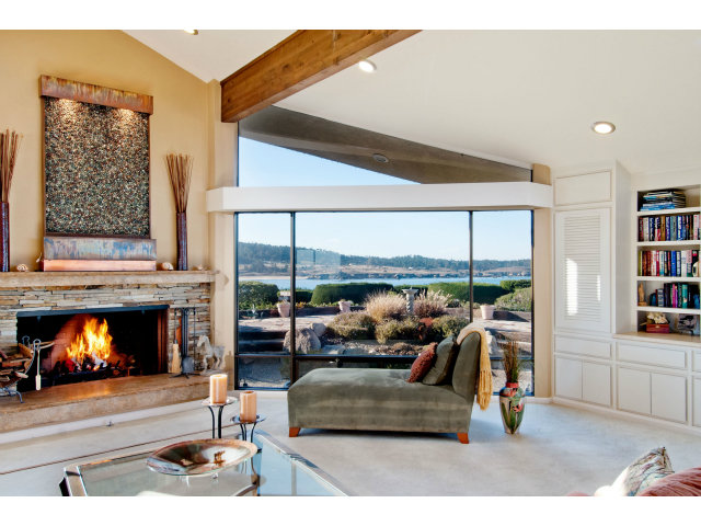 2697 Pradera Road Carmel, CA 93923 - Photo 6 of 22 a living room with furniture fireplace and a large window