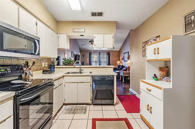a view of a kitchen with washer and dryer