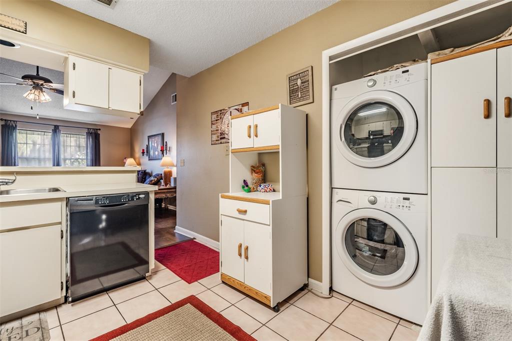 6338 Spring Flower Drive, Unit 21 New Port Richey, FL 34653 - Photo 15 of 35 a view of a kitchen with washer and dryer