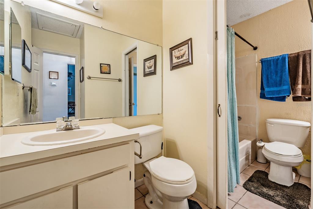 6338 Spring Flower Drive, Unit 21 New Port Richey, FL 34653 - Photo 18 of 35 a bathroom with a sink toilet and shower