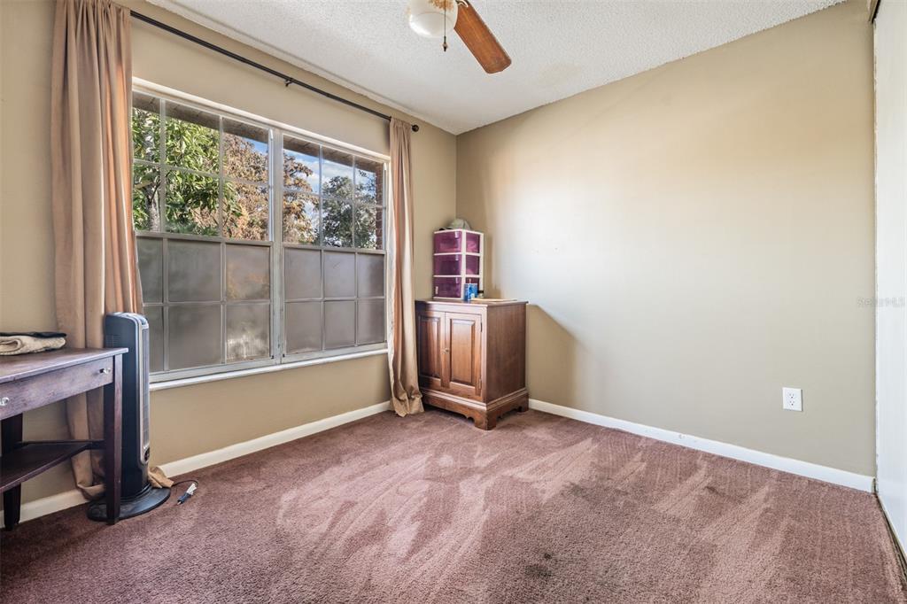 6338 Spring Flower Drive, Unit 21 New Port Richey, FL 34653 - Photo 20 of 35 a view of an empty room with a window
