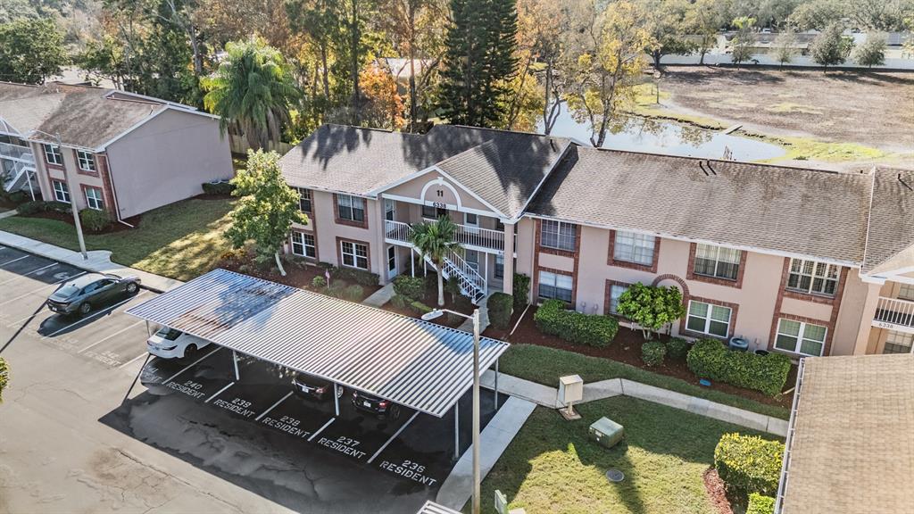 6338 Spring Flower Drive, Unit 21 New Port Richey, FL 34653 - Photo 27 of 35 an aerial view of a house with swimming pool and patio