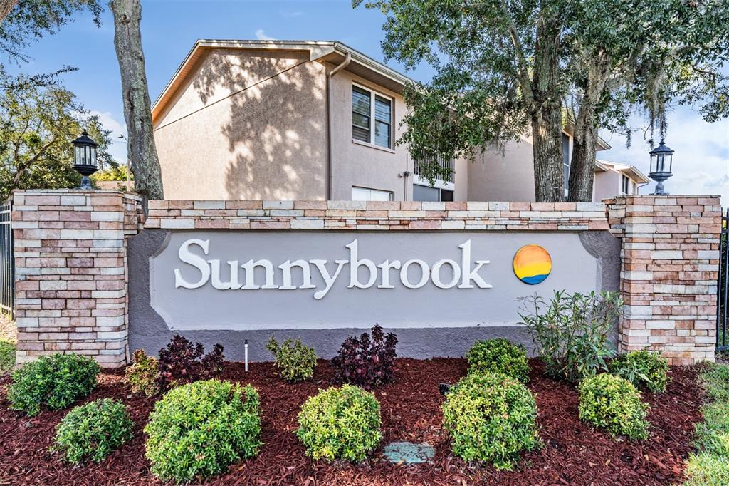 6338 Spring Flower Drive, Unit 21 New Port Richey, FL 34653 - Photo 30 of 35 a sign that is on the wall of the building