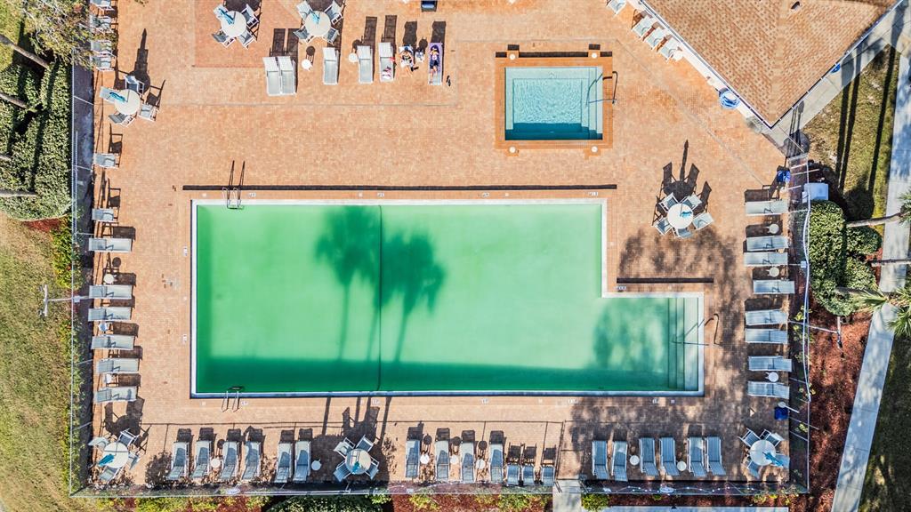 6338 Spring Flower Drive, Unit 21 New Port Richey, FL 34653 - Photo 33 of 35 a bathroom with a sink and a large mirror