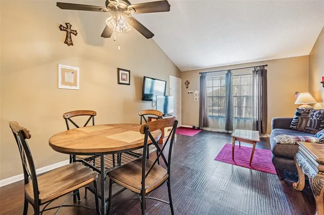 a view of a dining room with furniture and wooden floor