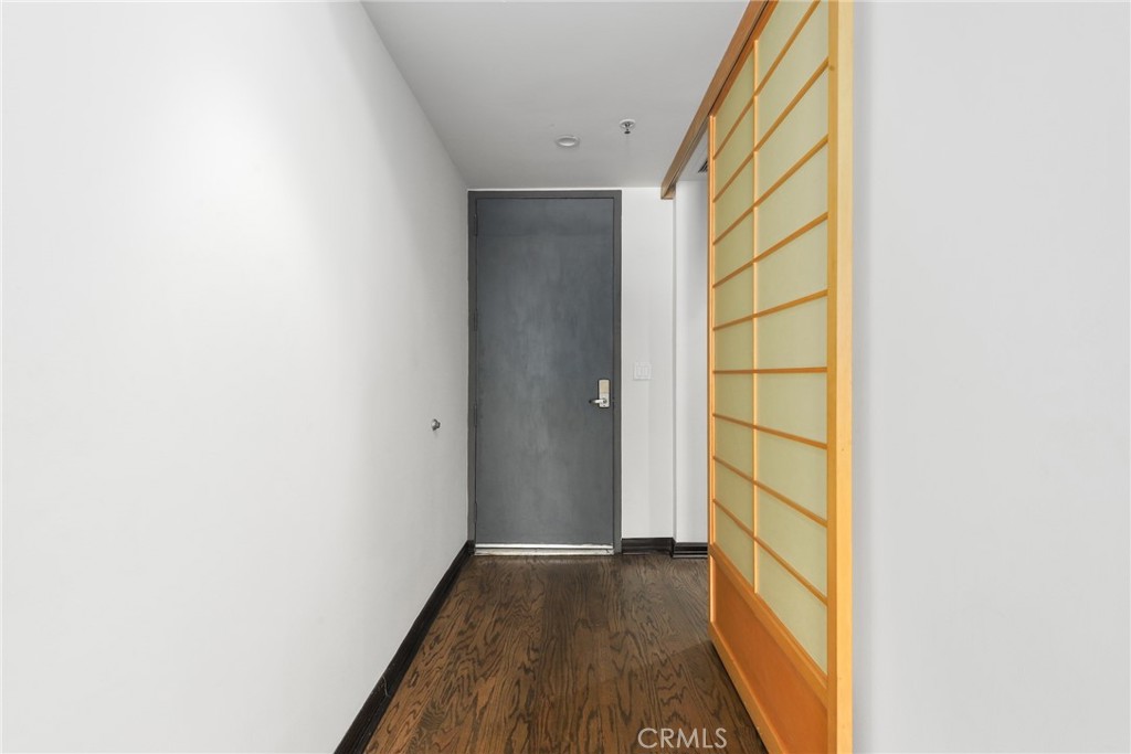 255 Main Street, Unit 103 Venice, CA 90291 - Photo 12 of 37 a view of a small space with wooden floor and a window