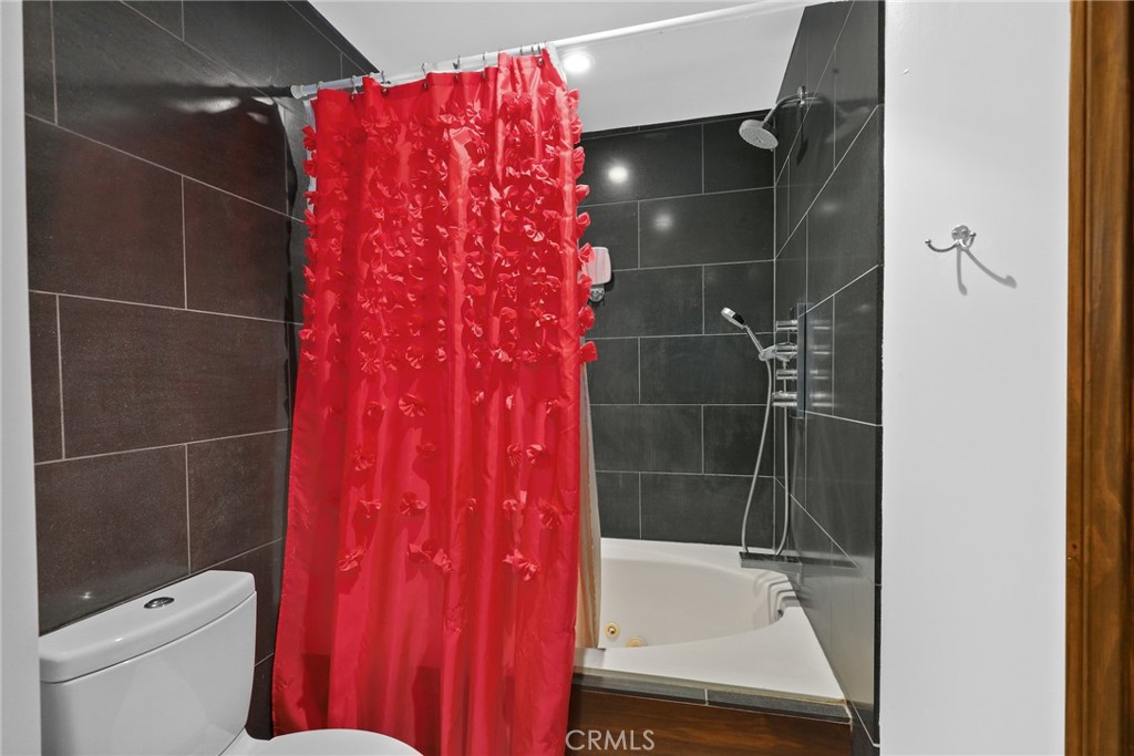 255 Main Street, Unit 103 Venice, CA 90291 - Photo 22 of 37 a bathroom with a shower and a toilet