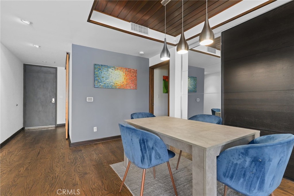 255 Main Street, Unit 103 Venice, CA 90291 - Photo 7 of 37 a view of a dining room with furniture and wooden floor