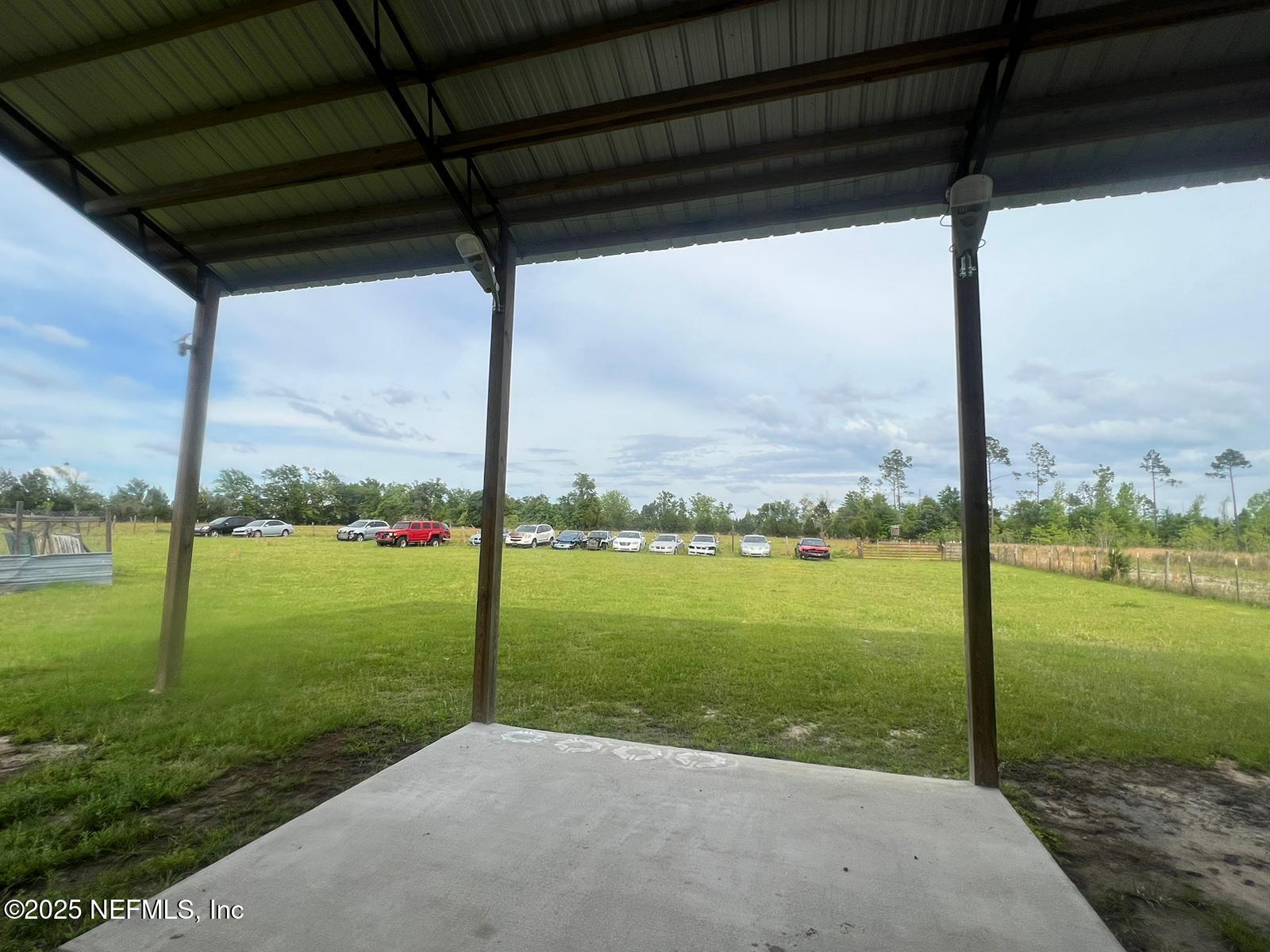 1730 Church Street Grand Ridge, FL 32442 - Photo 5 of 8 a view of a ocean from a big yard