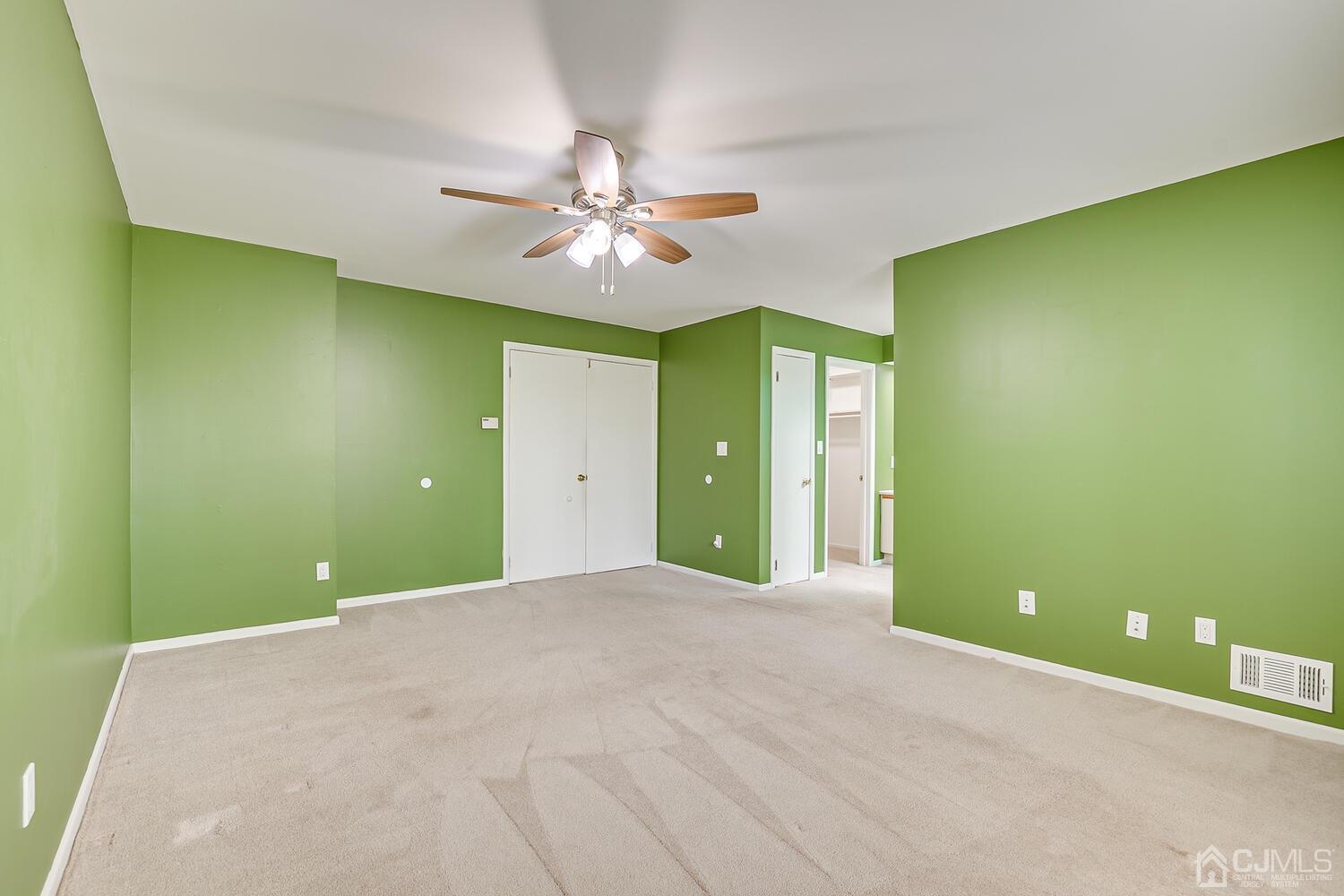 3603 Springbrook Drive Edison, NJ 08820 - Photo 14 of 30 a view of a room with a chandelier fan and a fireplace