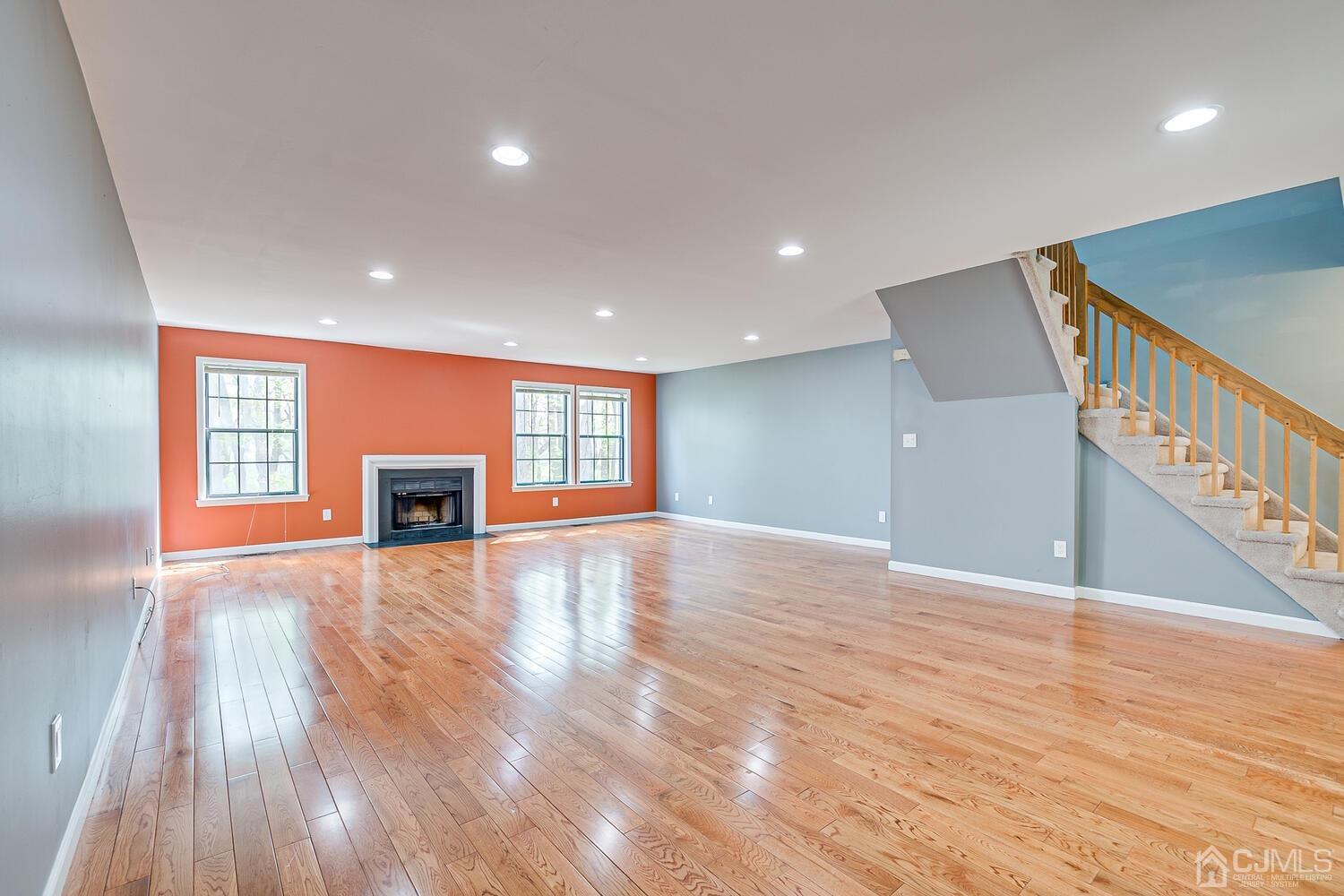 3603 Springbrook Drive Edison, NJ 08820 - Photo 5 of 30 a view of an empty room with wooden floor and a window