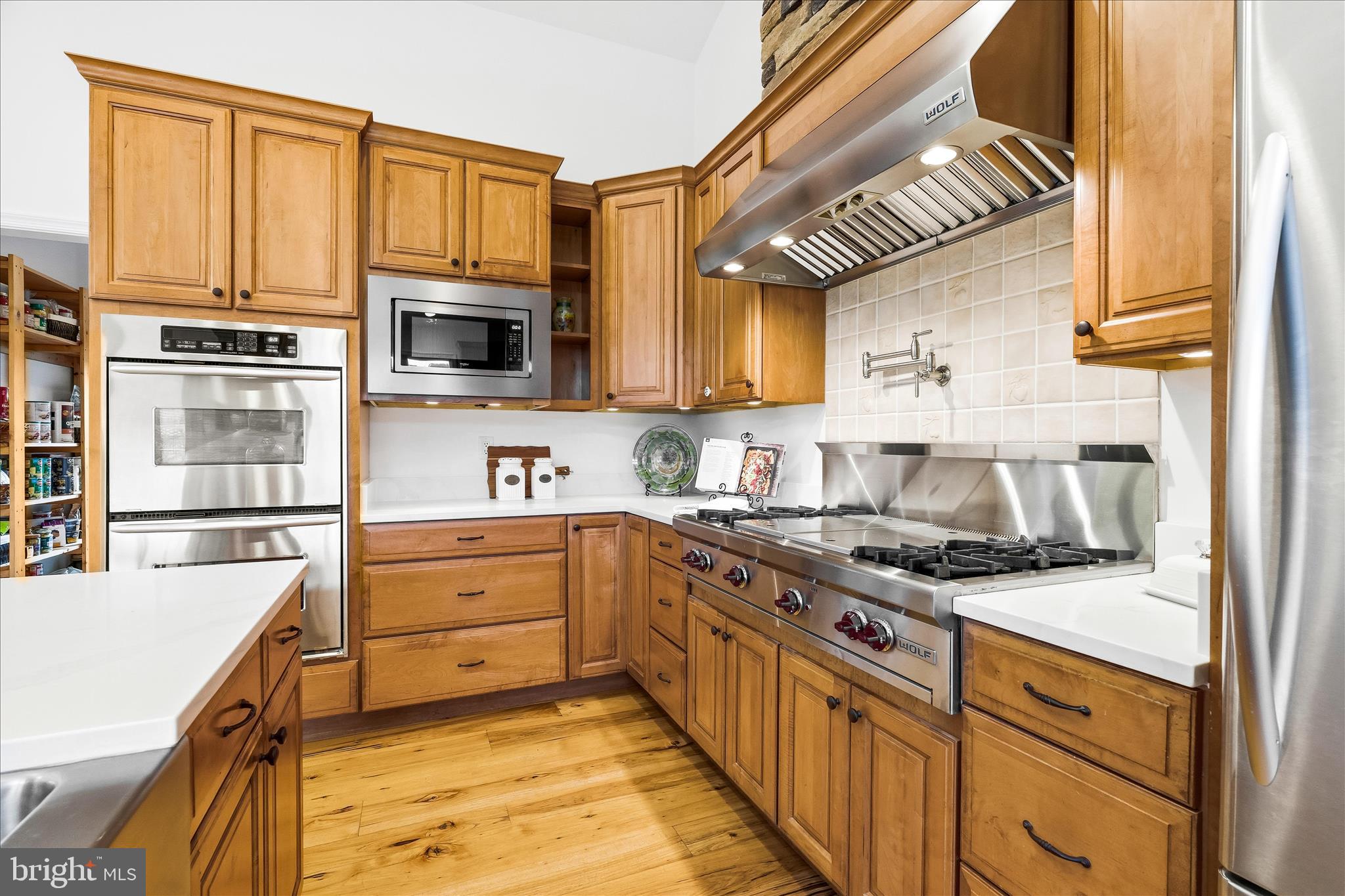 10691 Easterday Road Myersville, MD 21773 - Photo 19 of 79 a kitchen with stainless steel appliances granite countertop a stove and a sink