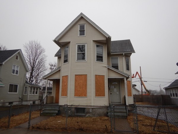 31-33 Collins Street Springfield, MA 01109 - Photo 1 of 30 a front view of a house with yard