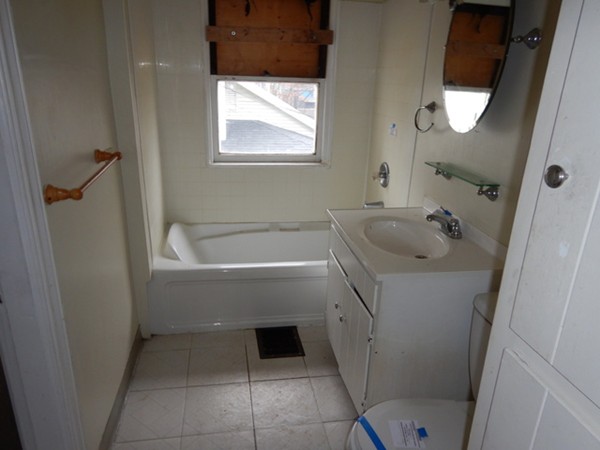 31-33 Collins Street Springfield, MA 01109 - Photo 14 of 30 a bathroom with a sink and bathtub