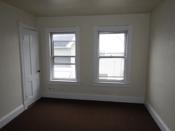 31-33 Collins Street Springfield, MA 01109 - Photo 15 of 30 a view of an empty room with a window