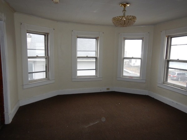 31-33 Collins Street Springfield, MA 01109 - Photo 16 of 30 a view of an empty room with a window