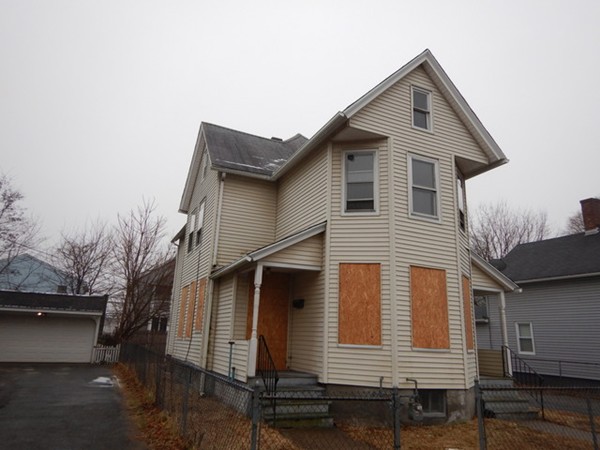 31-33 Collins Street Springfield, MA 01109 - Photo 2 of 30 a front view of a house with a yard