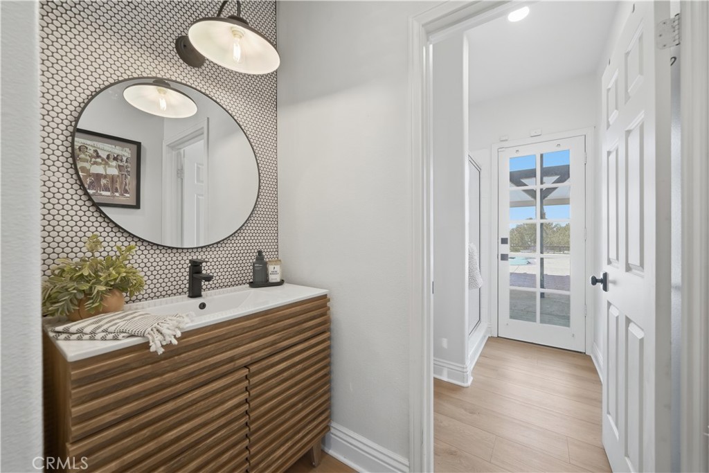 41110 Los Ranchos Circle Temecula, CA 92592 - Photo 47 of 77 a bathroom with a sink and a mirror