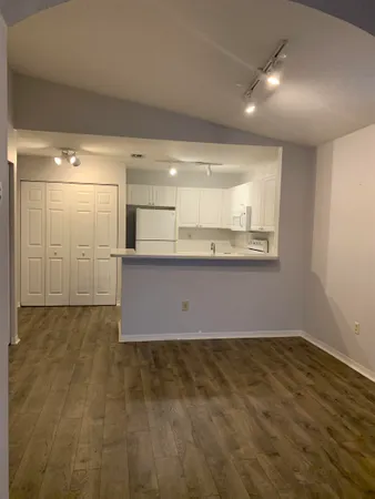 a view of a kitchen with a sink