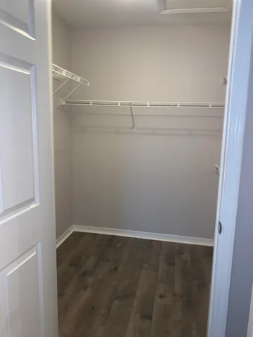 a view of an empty walk in closet
