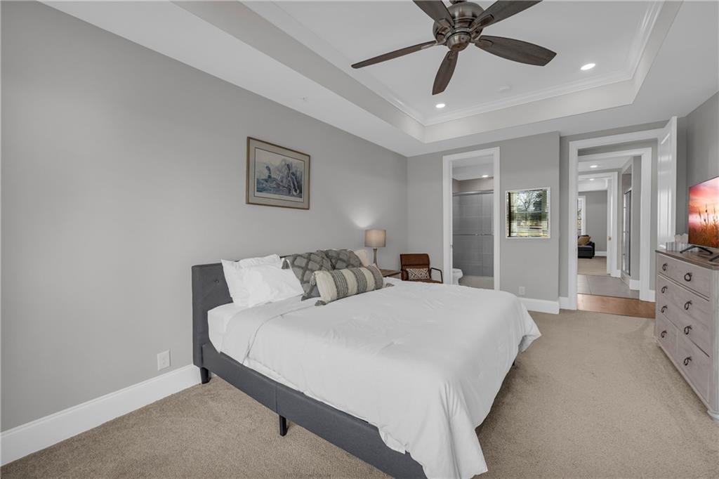 17 Cottage Lane Toccoa, GA 30577 - Photo 46 of 50 a spacious bedroom with a bed and a chandelier