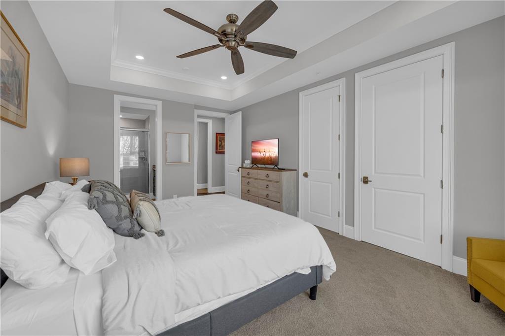 17 Cottage Lane Toccoa, GA 30577 - Photo 47 of 50 a spacious bedroom with a bed and a tv on a dresser