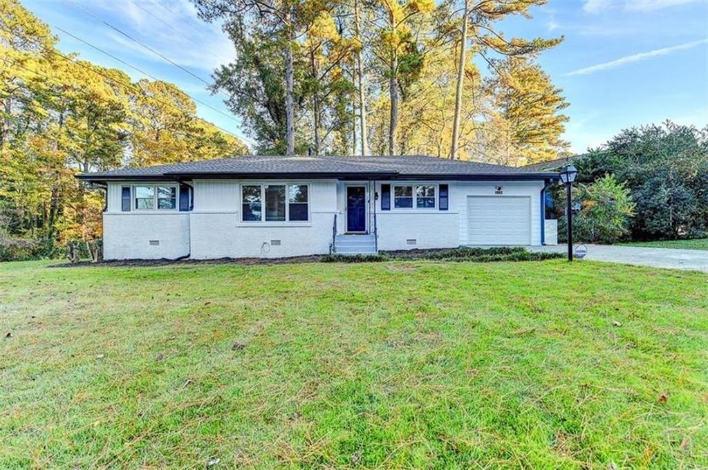 1957 Innwood Road Northeast Atlanta, GA 30329 - Photo 1 of 1 a view of a house with a garden
