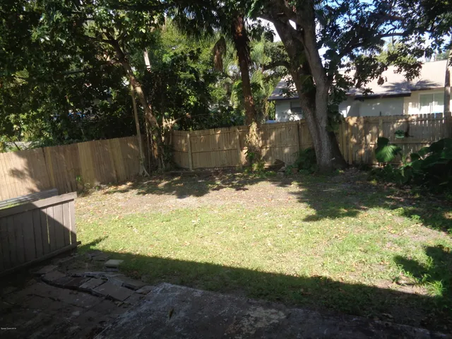 a view of backyard of a house