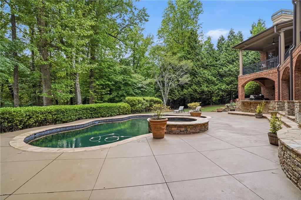 8340 Colonial Place Duluth, GA 30097 - Photo 55 of 74 a view of swimming pool with seating space