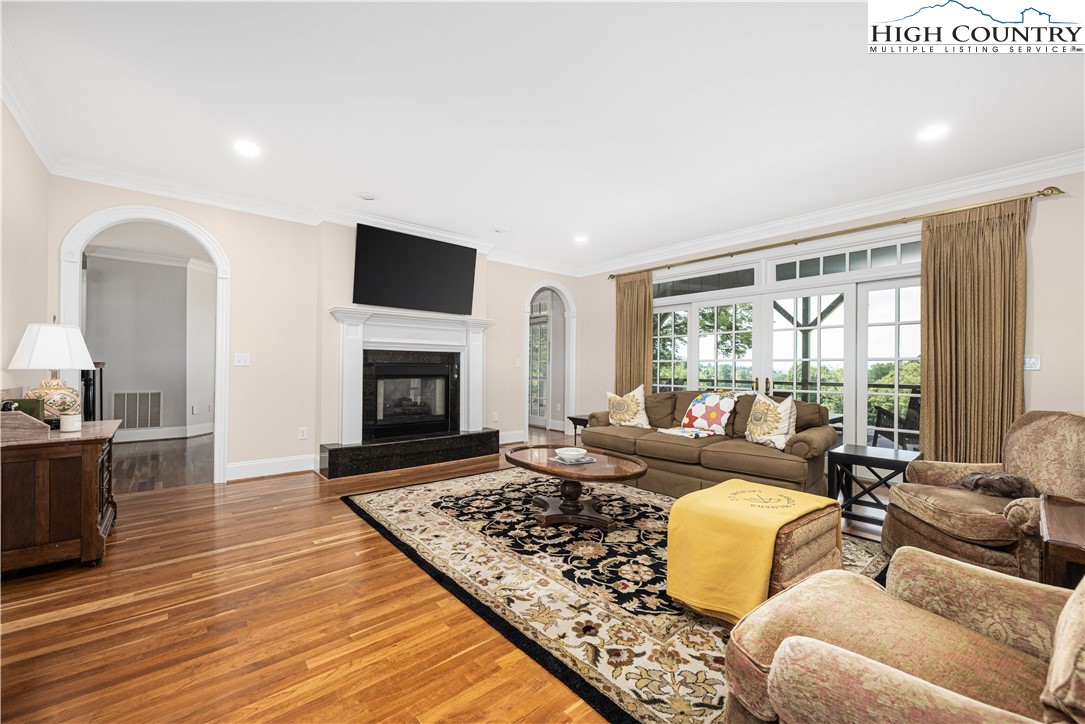 738 Country Club Road Glade Valley, NC 28627 - Photo 17 of 45 a living room with furniture fireplace and a flat screen tv